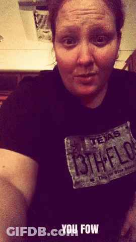 A Woman Wearing A Black Shirt With A Texas License Plate GIF