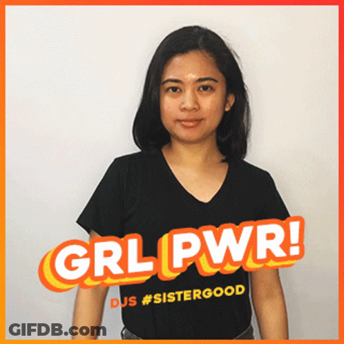 A Woman Wearing A Black Shirt With Grl Pwr Written On It GIF