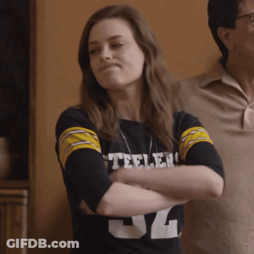 A Woman Wearing A Black Steelers Shirt With The Number 34 On It GIF