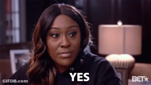 A Woman Wearing A Black Sweatshirt Says Yes GIF