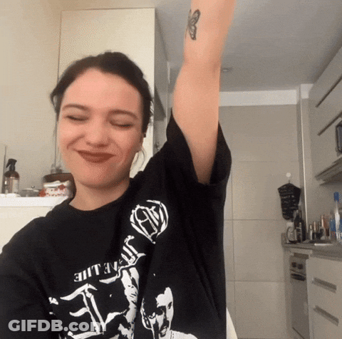 A Woman Wearing A Black T-Shirt That Says ' Death ' On It GIF