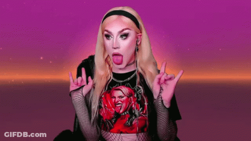 A Woman Wearing A Black T-Shirt With A Picture Of A Woman Sticking Her Tongue Out GIF