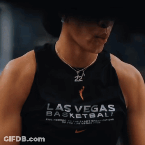 A Woman Wearing A Black Tank Top That Says Las Vegas Basketball On It GIF