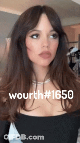 A Woman Wearing A Black Top And A Necklace With The Number 1650 On Her Chest GIF