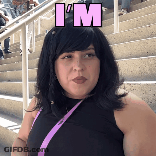 A Woman Wearing A Black Top And A Purple Lanyard With The Word I 'M On It GIF