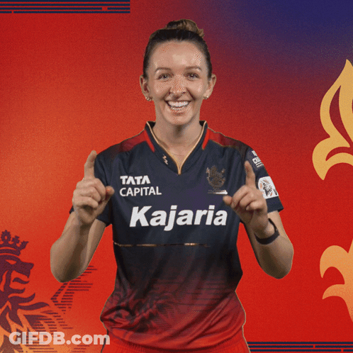 A Woman Wearing A Blue And Red Shirt That Says Kajaria GIF
