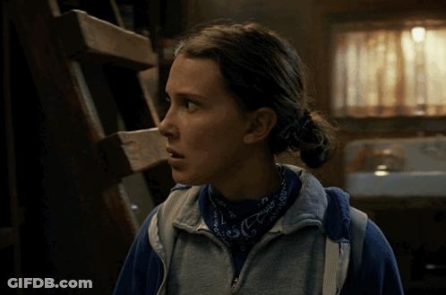 A Woman Wearing A Blue Bandana And A Sweatshirt With The Letter E On It GIF