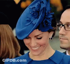 A Woman Wearing A Blue Hat And A Blue Dress GIF