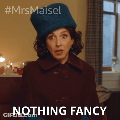 A Woman Wearing A Blue Hat And Gloves Says " Nothing Fancy " GIF