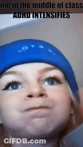 A Woman Wearing A Blue Hat With The Words Me In The Middle Of Class Adhd Intensifies Written On It GIF