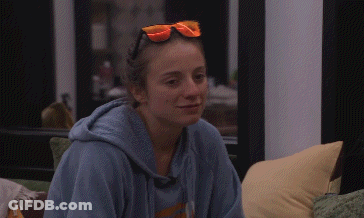A Woman Wearing A Blue Hoodie And Orange Sunglasses GIF