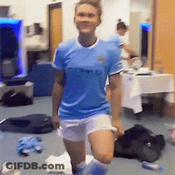 A Woman Wearing A Blue Shirt That Says City On It GIF