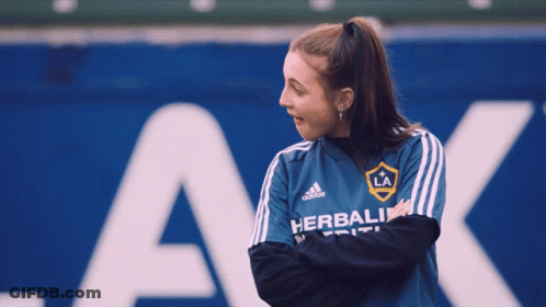 A Woman Wearing A Blue Shirt That Says Herbalife GIF