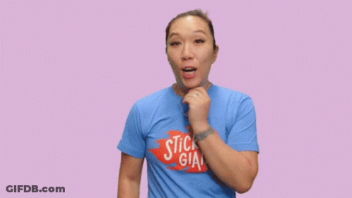 A Woman Wearing A Blue Shirt That Says Hump Day On It GIF