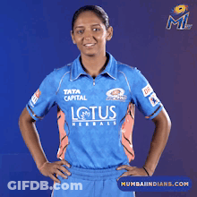 A Woman Wearing A Blue Shirt That Says Lotus On It GIF