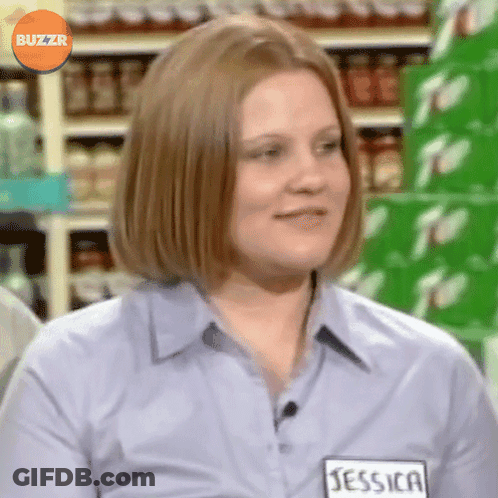A Woman Wearing A Blue Shirt With A Name Tag That Says Jessica GIF