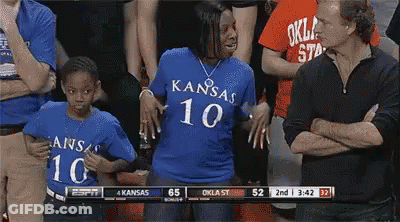 A Woman Wearing A Blue Shirt With Kansas 10 On The Front GIF