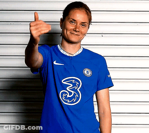 A Woman Wearing A Blue Shirt With The Number 3 On It Is Giving A Thumbs Up GIF