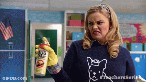 A Woman Wearing A Blue Sweater With A Dog On It Is Holding A Can Of Bug Spray . GIF