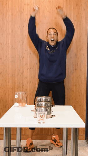 A Woman Wearing A Blue Sweatshirt That Says ' I Love Ny ' On It GIF