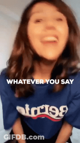 A Woman Wearing A Blue T-Shirt That Says Whatever You Say GIF