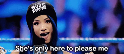 A Woman Wearing A Boss Hat Is Talking Into A Microphone And Saying She 'S Only Here To Please Me GIF