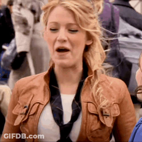 A Woman Wearing A Brown Leather Jacket And A Black Tie GIF