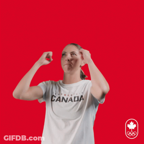 A Woman Wearing A Canada T-Shirt Has Her Hands Up In The Air GIF