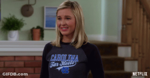 Woman In Carolina Tar Heels Shirt Smiling GIF