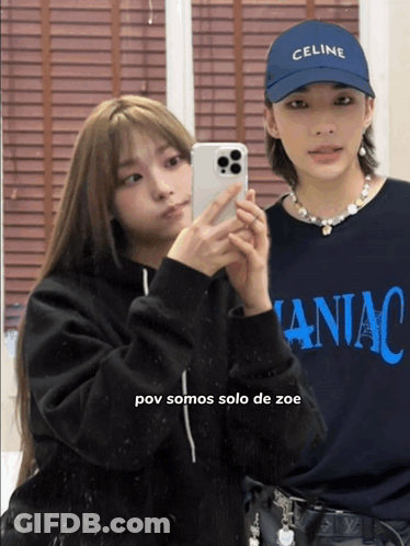 A Woman Wearing A Celine Hat Takes A Picture Of Herself GIF