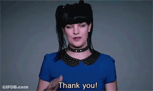 A Woman Wearing A Choker And A Blue Shirt Says Thank You GIF