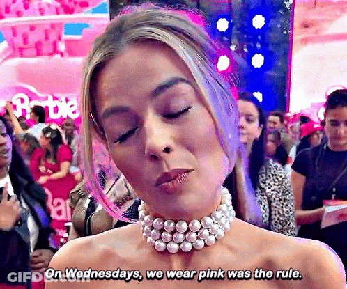 A Woman Wearing A Choker And Pearls Says On Wednesdays We Wear Pink Was The Rule GIF
