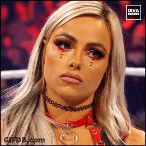 A Woman Wearing A Choker And Red Eye Shadow Is Featured In A Diva Girls Ad GIF
