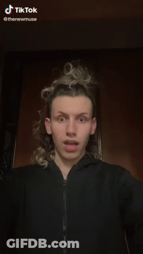 A Woman Wearing A Choker Is Being Touched By A Man 'S Hand .. GIF
