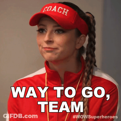 A Woman Wearing A Coach Hat And A Red Jacket Says Way To Go Team GIF