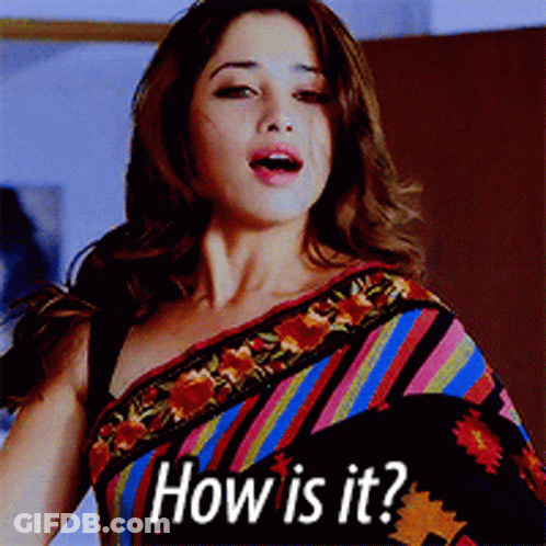 A Woman Wearing A Colorful Striped Saree Is Asking " How Is It " GIF