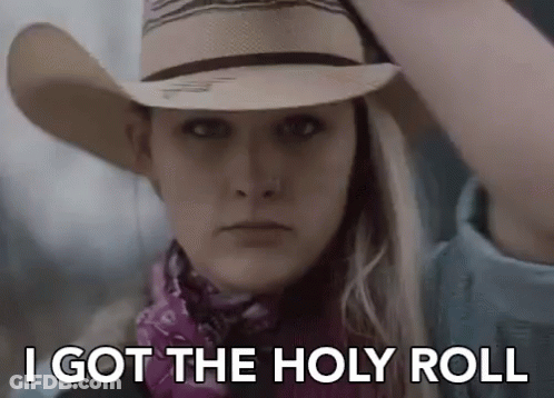 A Woman Wearing A Cowboy Hat And A Bandana Is Saying `` I Got The Holy Roll '' GIF