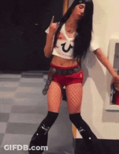 A Woman Wearing A Crop Top With A Letter U On It GIF
