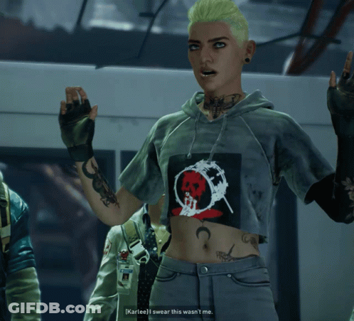 A Woman Wearing A Crop Top With A Skull On It GIF