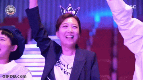 A Woman Wearing A Crown On Her Head Is Smiling GIF