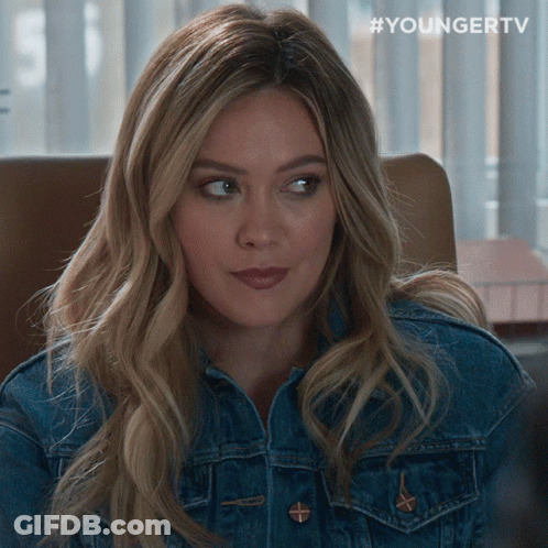 A Woman Wearing A Denim Jacket Has #Youngertv Written On The Bottom GIF