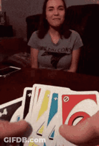 A Woman Wearing A Falcons Shirt Sits At A Table With Cards GIF