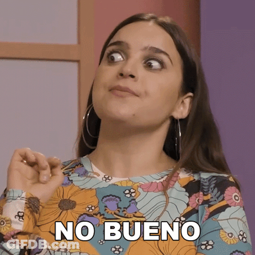 A Woman Wearing A Floral Shirt Has The Word No Bueno On Her Face GIF
