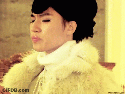 A Woman Wearing A Fur Coat And Pearls Has Taemarshmallow Written On The Bottom Right GIF