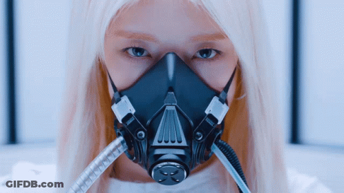 A Woman Wearing A Gas Mask With The Letter X On It GIF