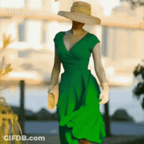A Woman Wearing A Green Dress And A Straw Hat Is Made With The Reface App GIF