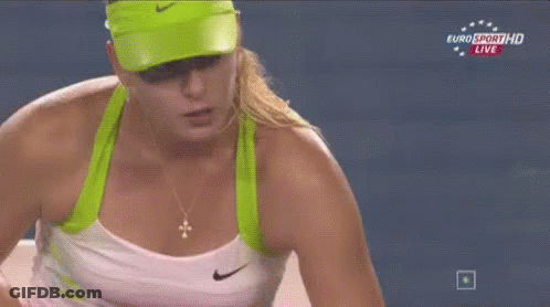 A Woman Wearing A Green Hat And A White Tank Top Is On Euro Sport Hd Live GIF