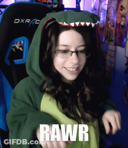 A Woman Wearing A Green Hoodie With The Word Rawr On Her Chest GIF