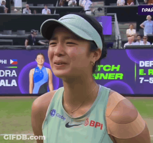A Woman Wearing A Green Nike Tank Top With Bpi Written On It GIF
