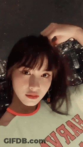 A Woman Wearing A Green Shirt That Says ' Yrah ' On It GIF